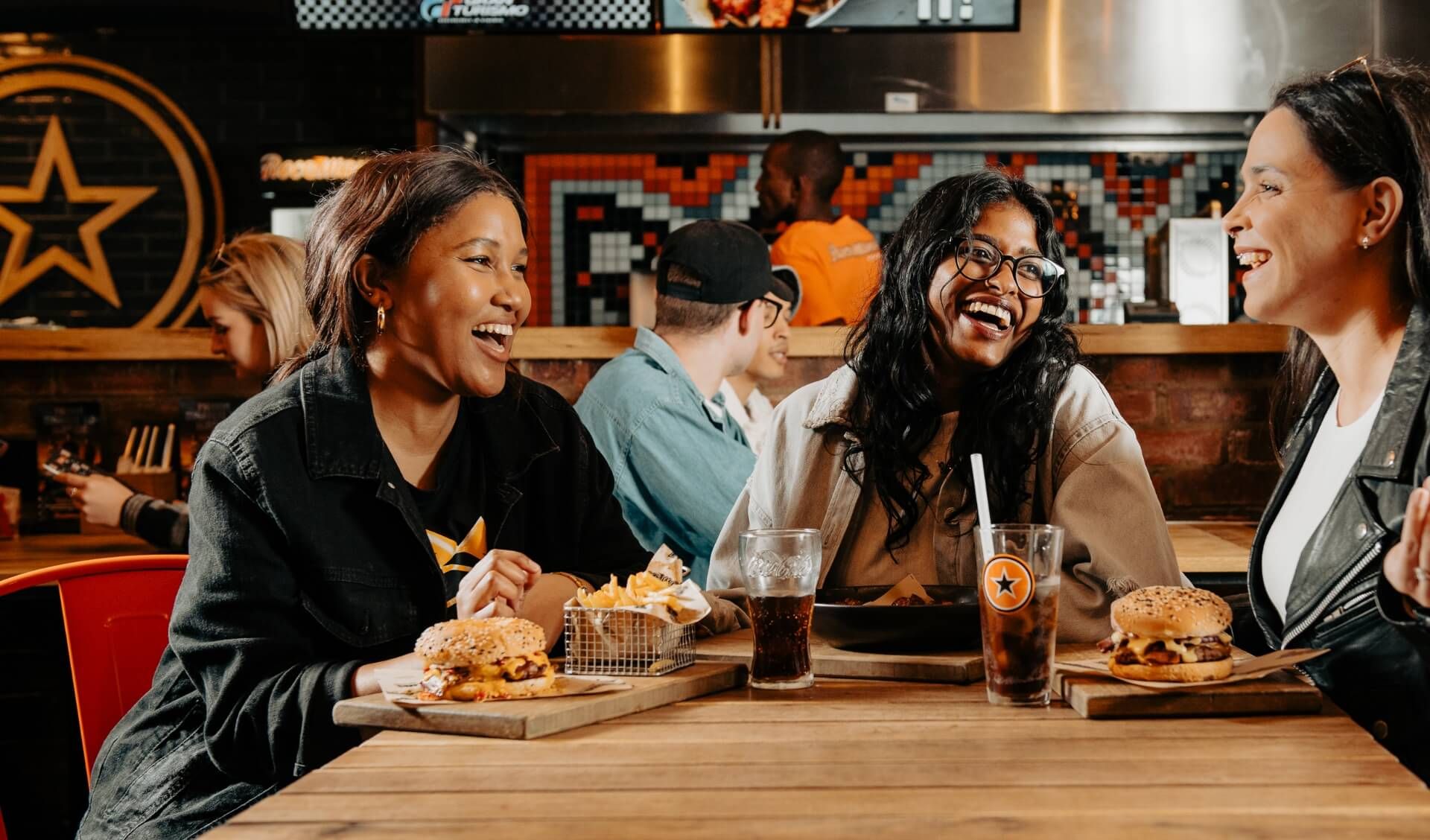 Group of friends enjoying a RocoMamas meal